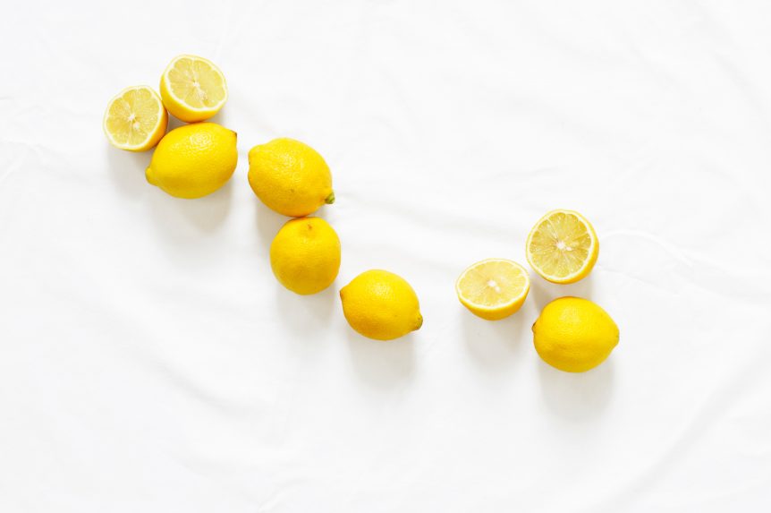 lemons on w white plate to use for a simple spring cleanse