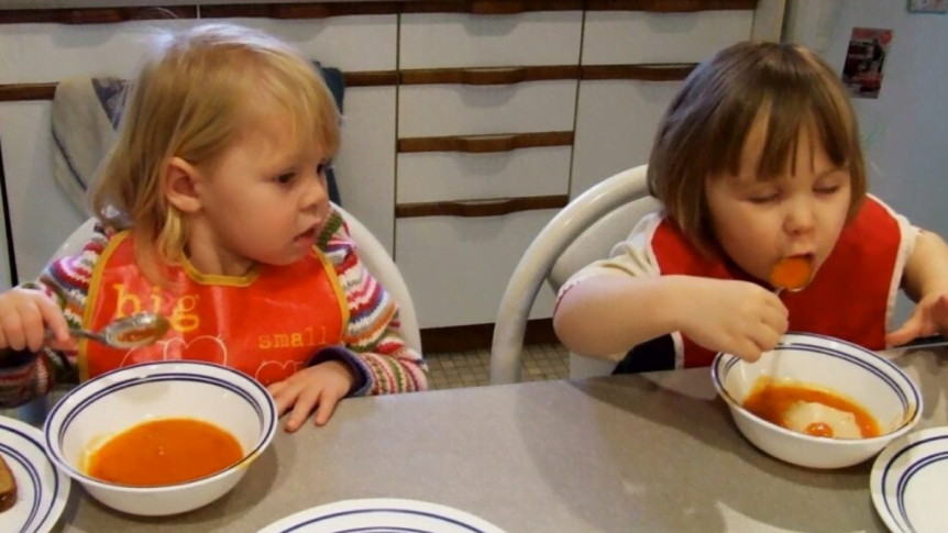 Children ages 1-5 eating at a table