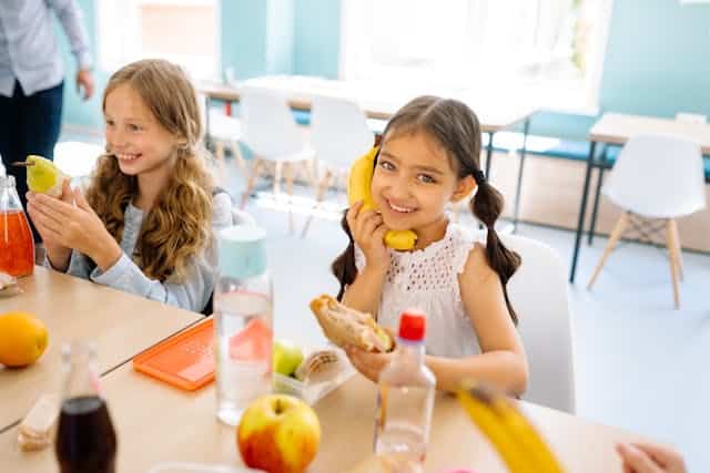 A girl eating a meal that supports her immunity nutritionally.