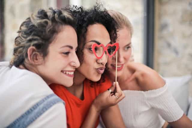 Three women cycle syncing.