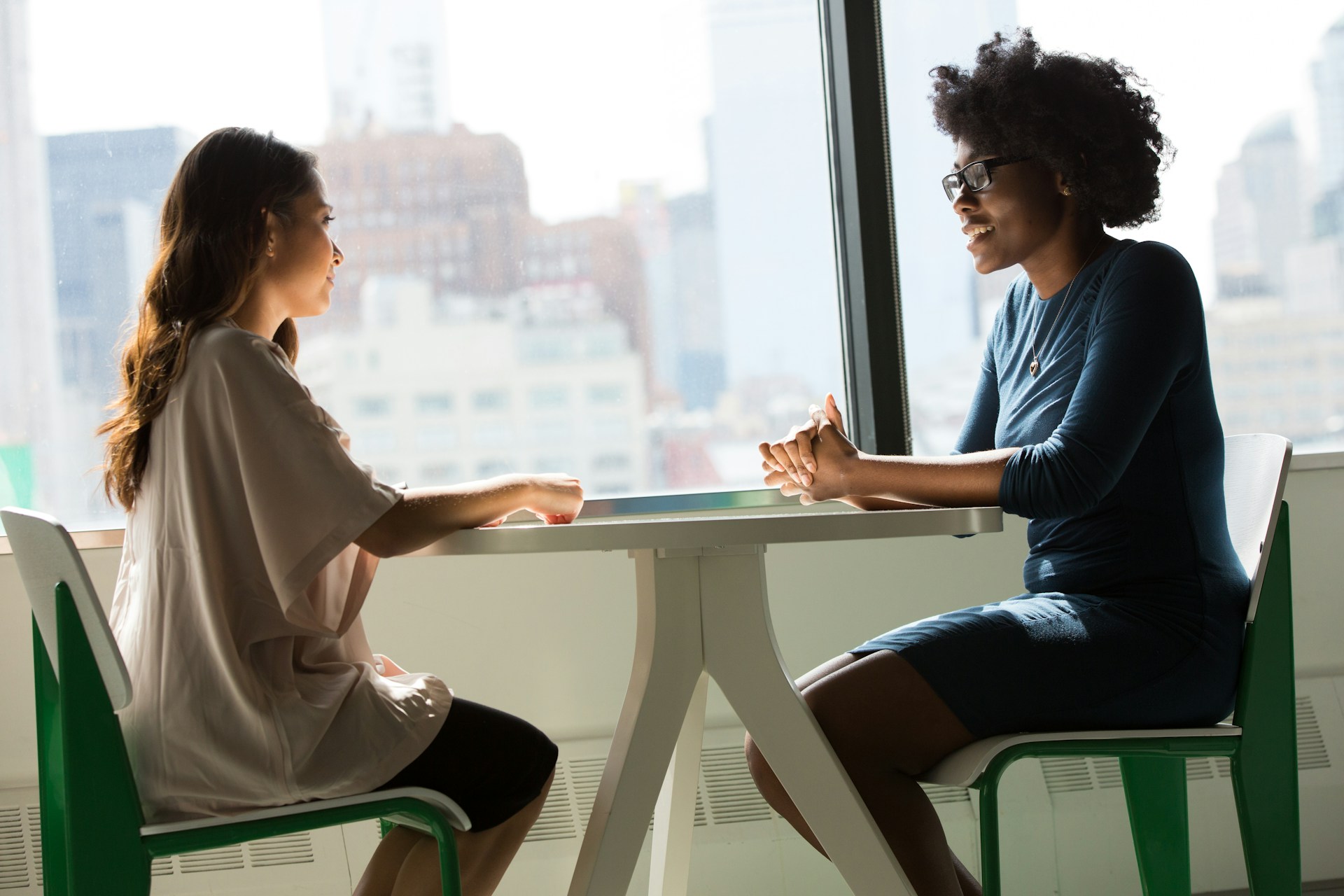 Nutrition therapist consulting with a client about wellness and nutrition therapy.