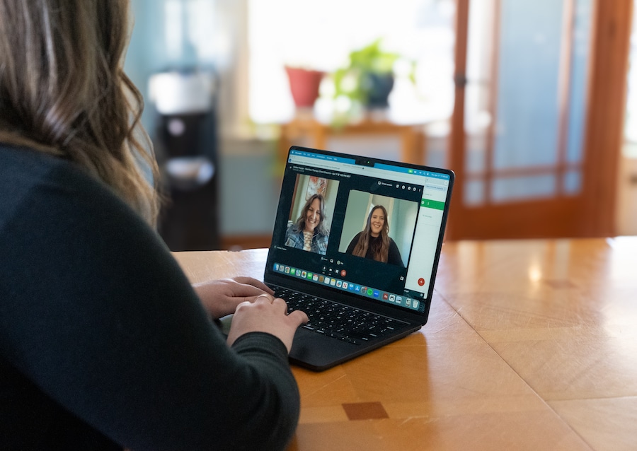 Holistic nutrition client and practitioner in a telehealth session discussing personalized dietary recommendations online.
