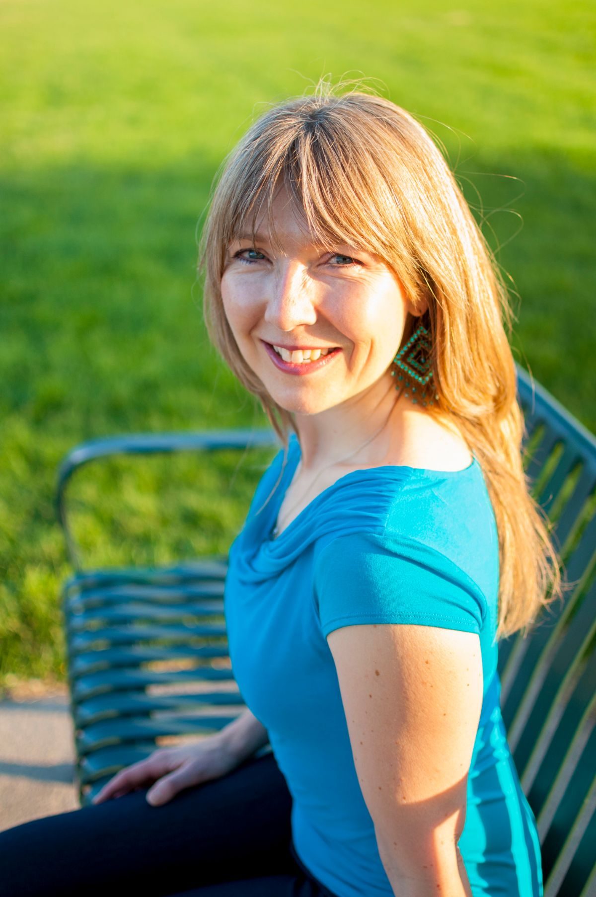 Amanda Halliday wearing a blue shirt sitting outside